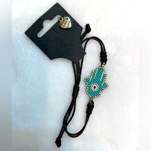 thread and pearl bracelet with design